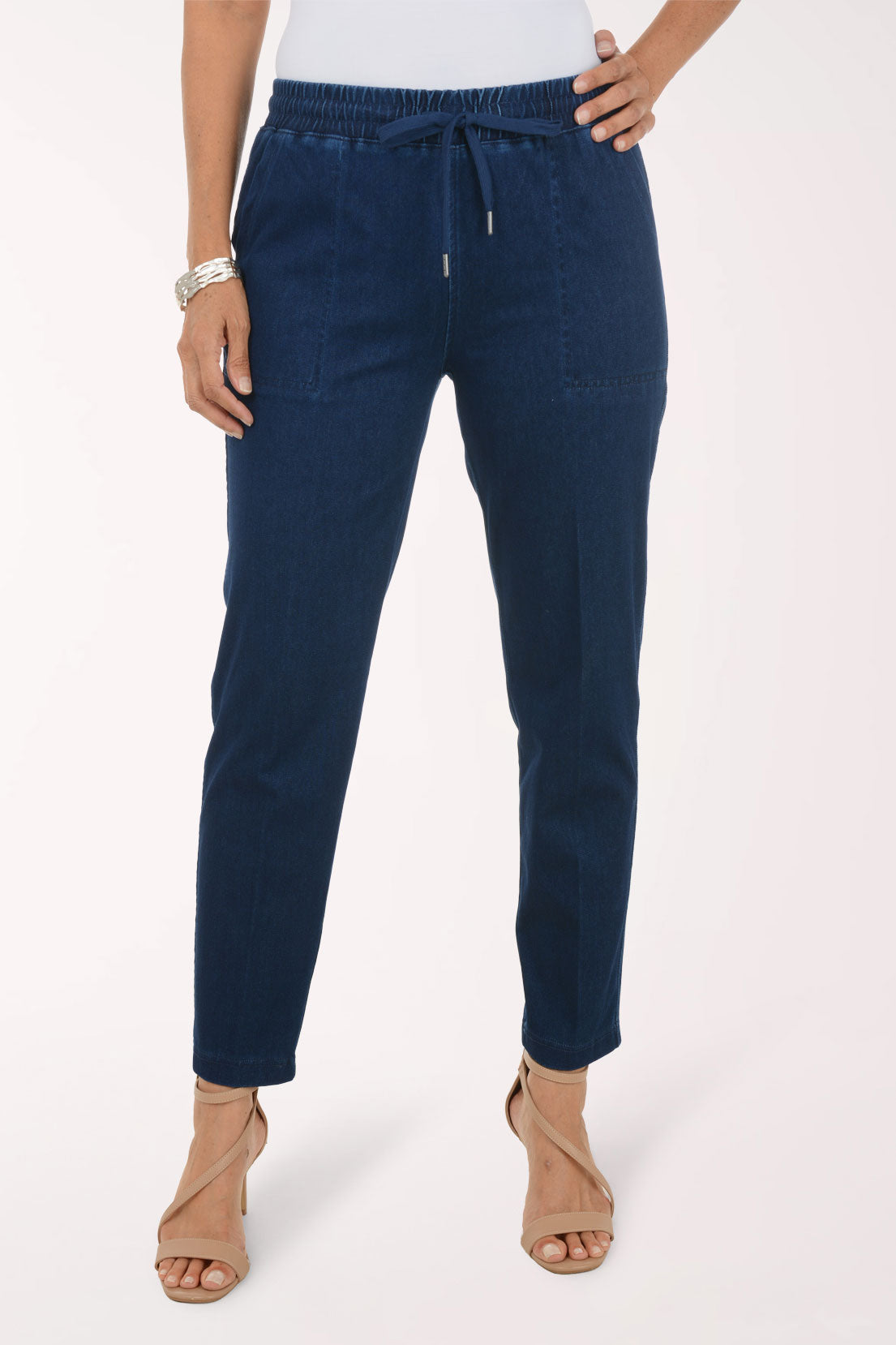 Close-up of the drawstring waist with silver-tipped ends and front patch pockets on the Dark Wash Drawstring Relaxed Denim Pant