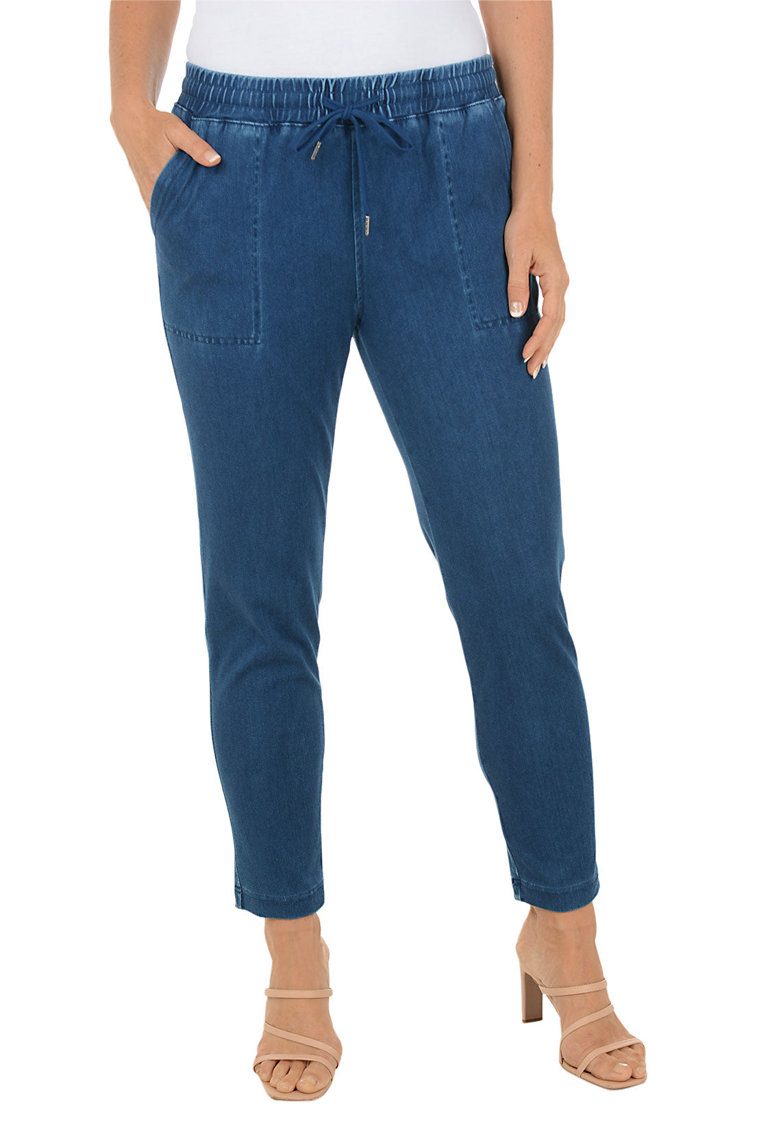 Blue jeans worn by a person on a white background.