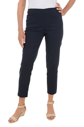 A front shot of a model wearing Navy pull-on ankle pants with an elastic waistband and dual front and back slit pockets.