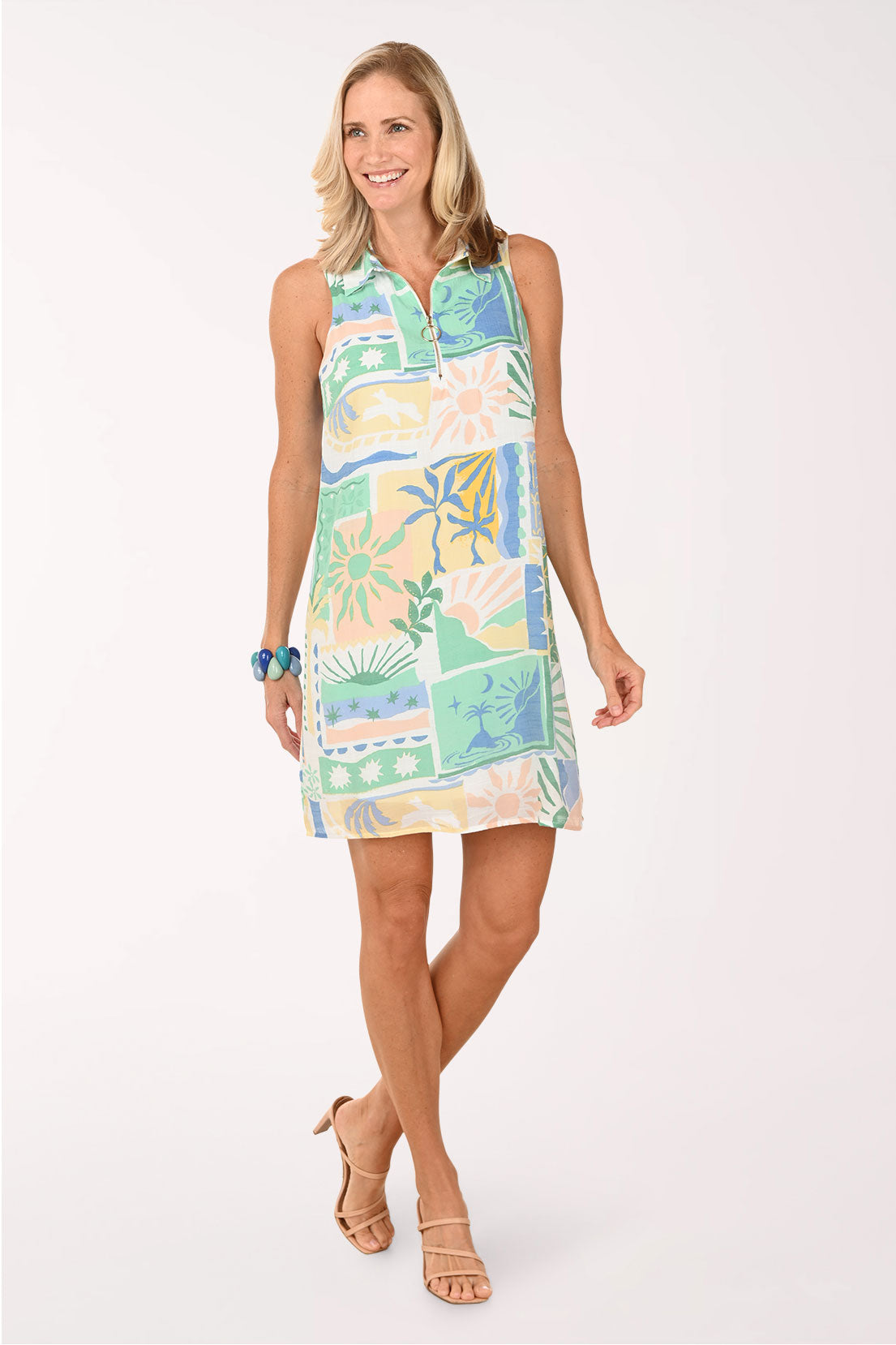 Woman wearing a colorful patterned dress on a white background
