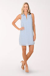 Woman wearing a blue patterned dress on a white background