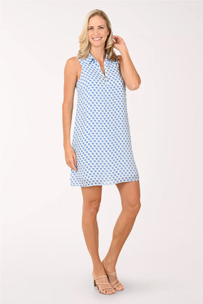 Woman wearing a blue patterned dress on a white background