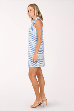Woman wearing a blue patterned dress on a white background
