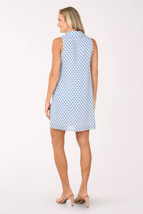 Woman wearing a blue patterned dress on a white background