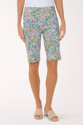 Person wearing colorful patterned shorts on a white background