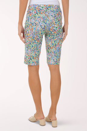 Person wearing colorful patterned shorts on a white background