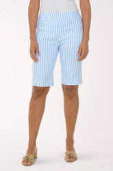 Person wearing light blue and white striped shorts on a white background