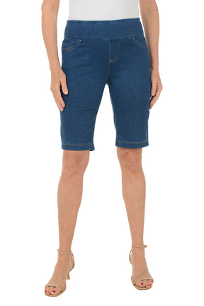 Blue denim shorts worn by a person on a white background