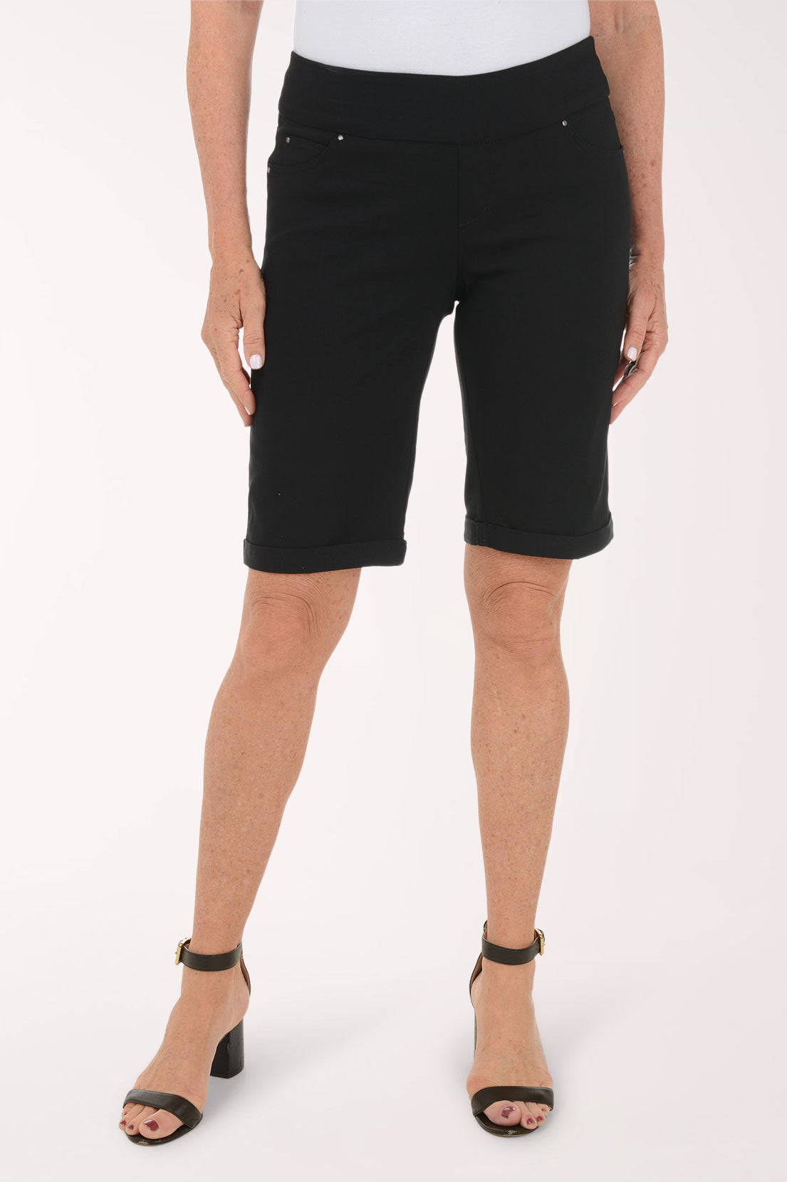 Person wearing black shorts on a white background