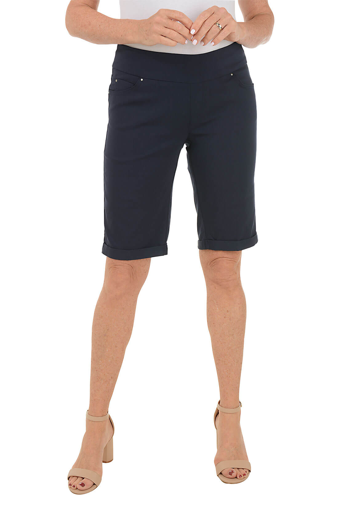 Person wearing navy blue shorts on a white background