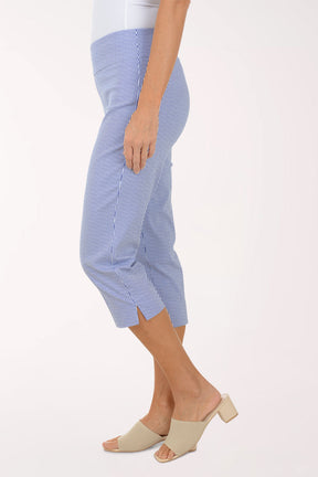 Person wearing blue checkered pants on a white background