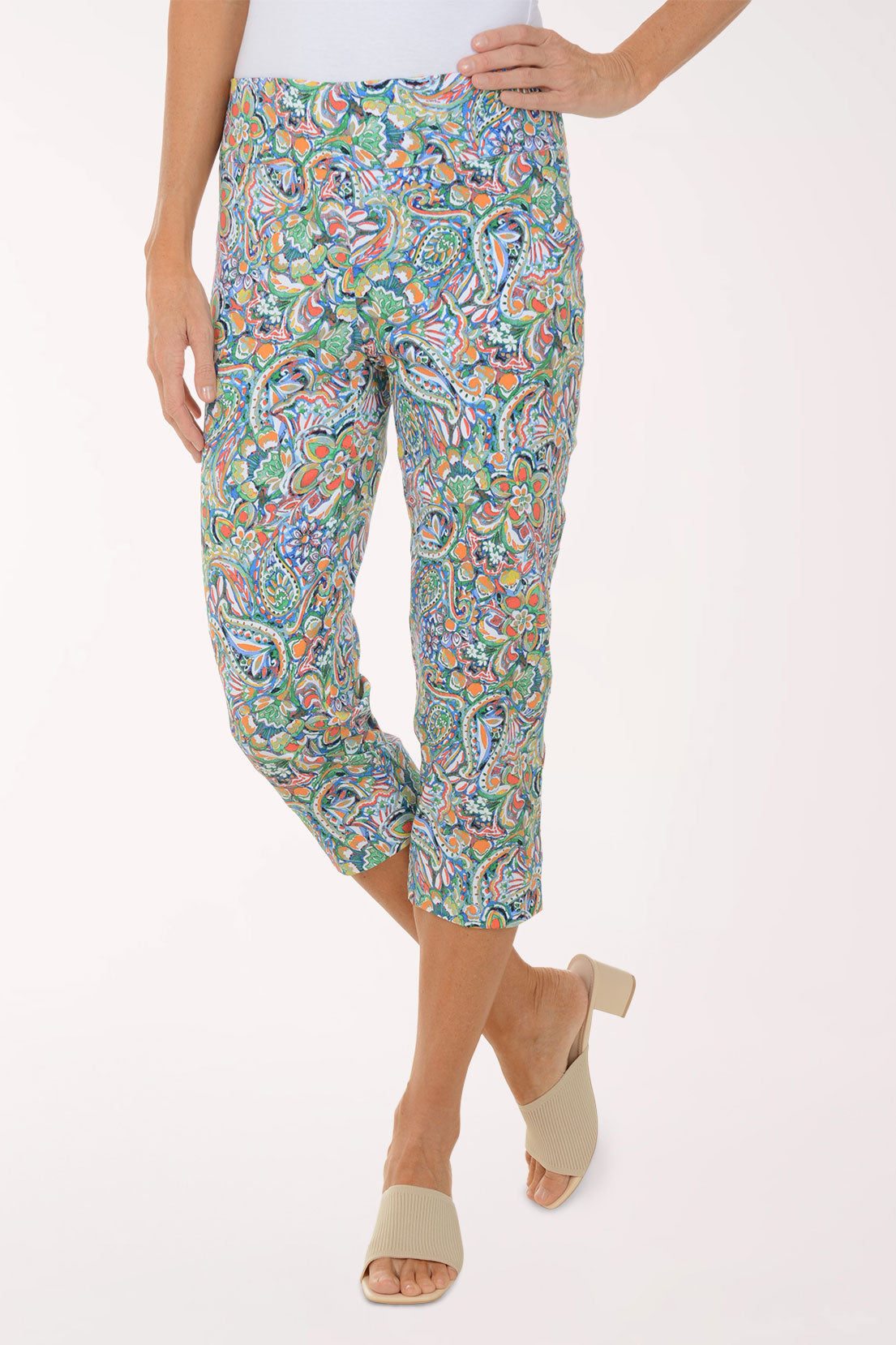 Colorful patterned pants worn by a person on a white background