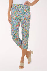 Colorful patterned pants worn by a person on a white background