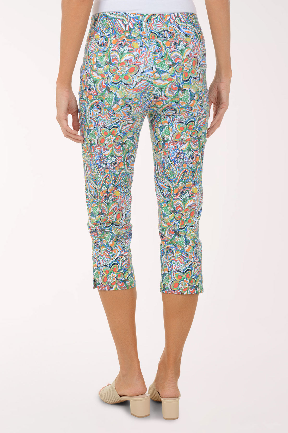 Colorful patterned pants worn by a person on a white background