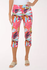 Colorful patterned capri pants worn by a person on a white background