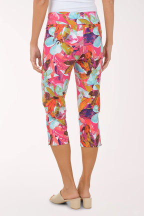 Colorful patterned capri pants worn by a person on a white background