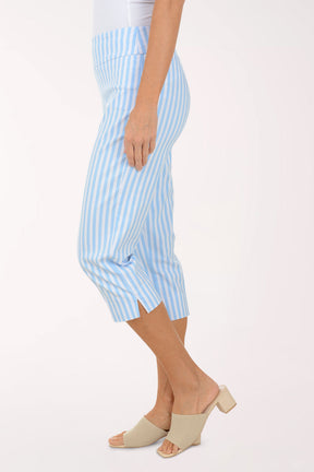 Person wearing light blue and white striped pants on a white background