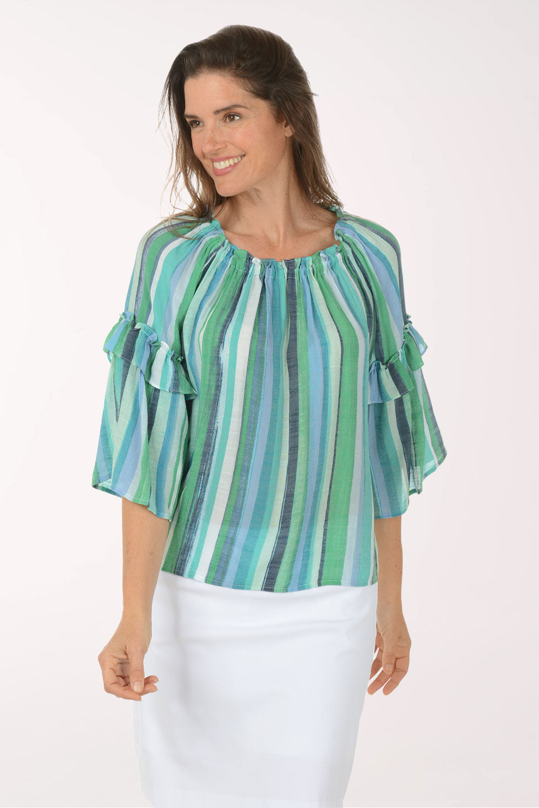 Woman wearing a green and blue striped blouse on a white background