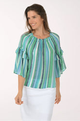 Woman wearing a green and blue striped blouse on a white background