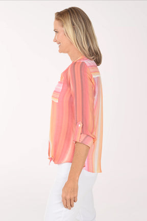 Woman wearing a pink and orange striped blouse on a white background
