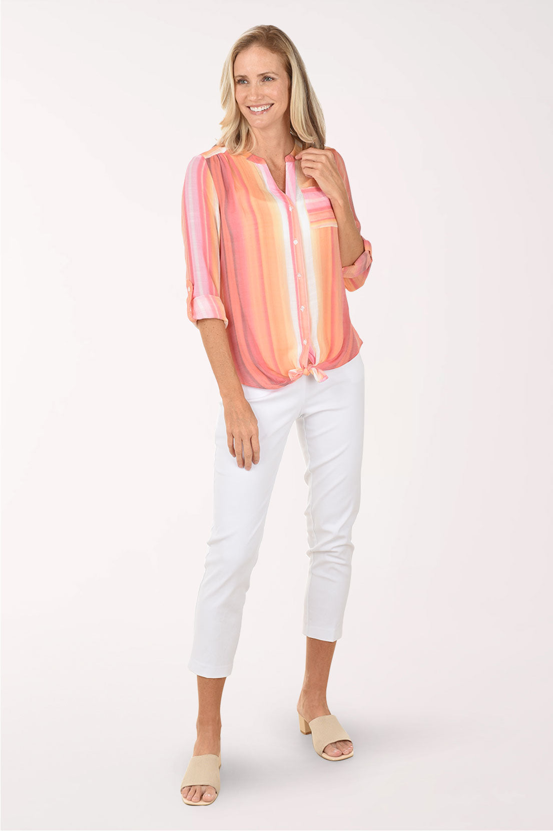 Woman wearing a pink and orange striped blouse on a white background