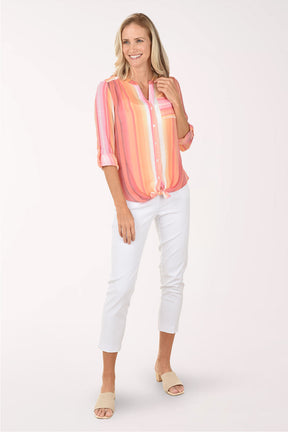 Woman wearing a pink and orange striped blouse on a white background