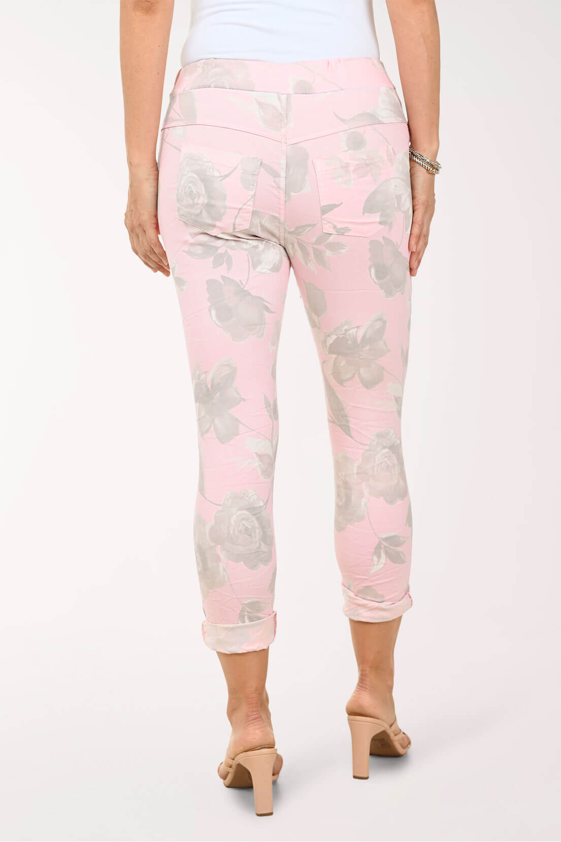 Back shot of a Woman wearing pink floral joggers