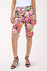 Colorful floral-patterned shorts worn by a person on a white background