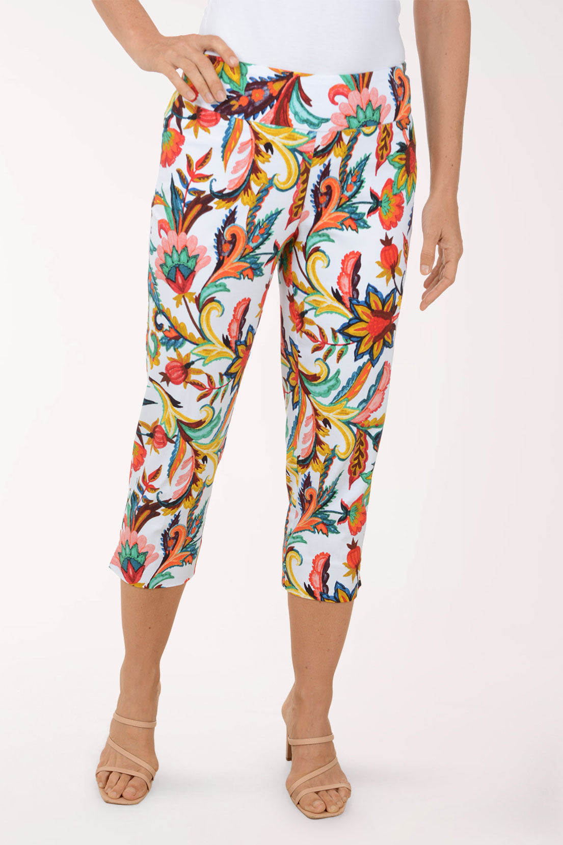 Colorful floral-patterned pants worn by a person on a white background