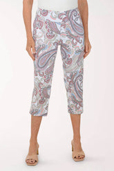 Person wearing a patterned capri pants on a white background