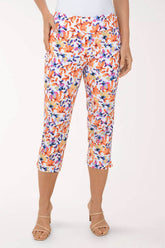 Multicolored floral capri pants worn by a person on a white background