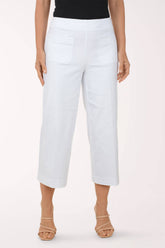 White pants worn by a person on a white background