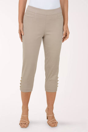 Beige capri pants worn by a person on a white background