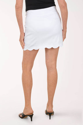 White skirt worn by a person on a white background