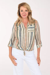 Woman wearing a green striped button down blouse