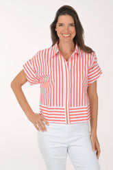 Woman wearing a red and white striped shirt with a white background