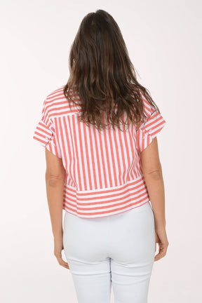 Woman wearing a red and white striped shirt with a white background