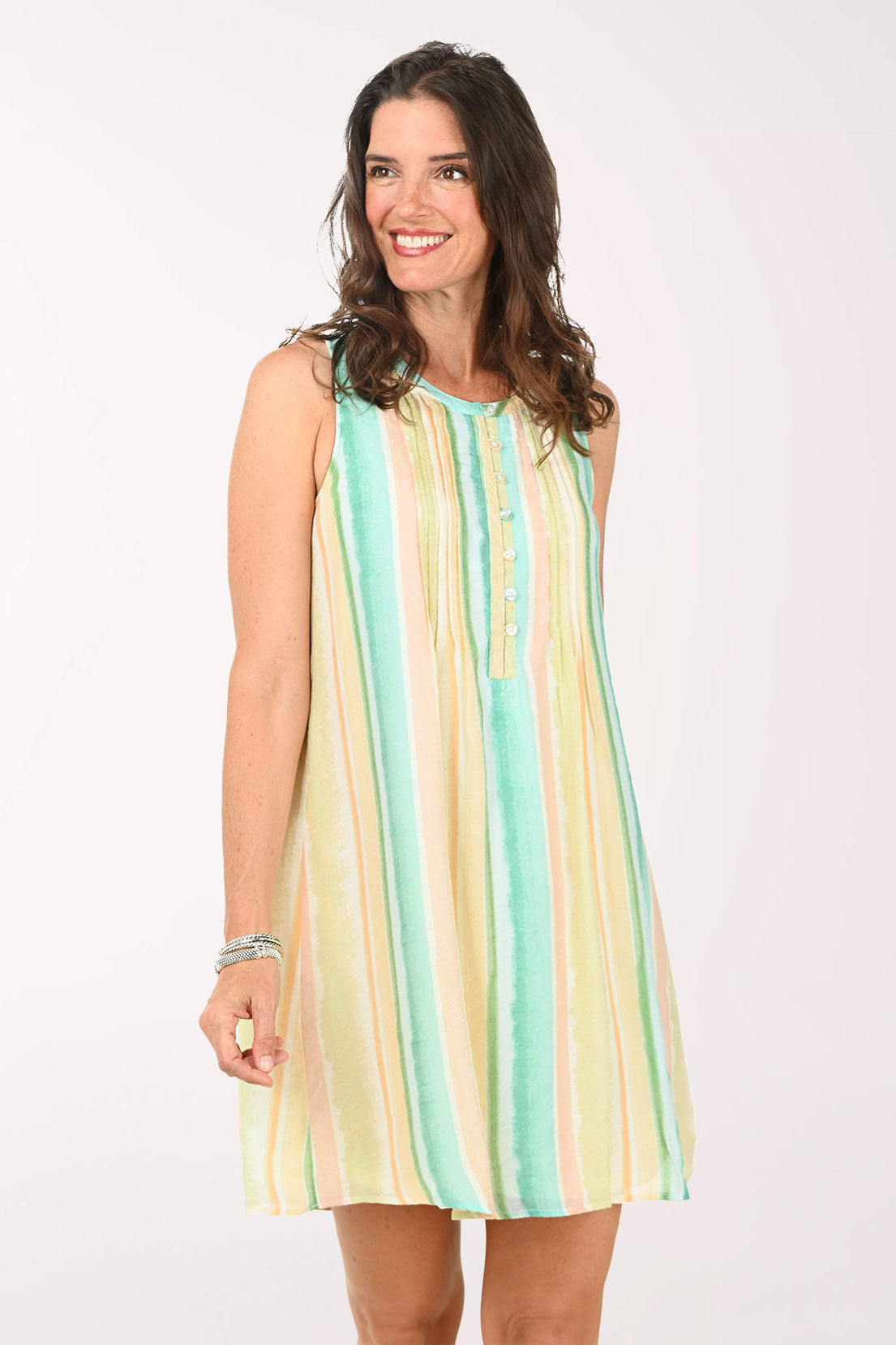 Woman wearing a striped dress on a white background