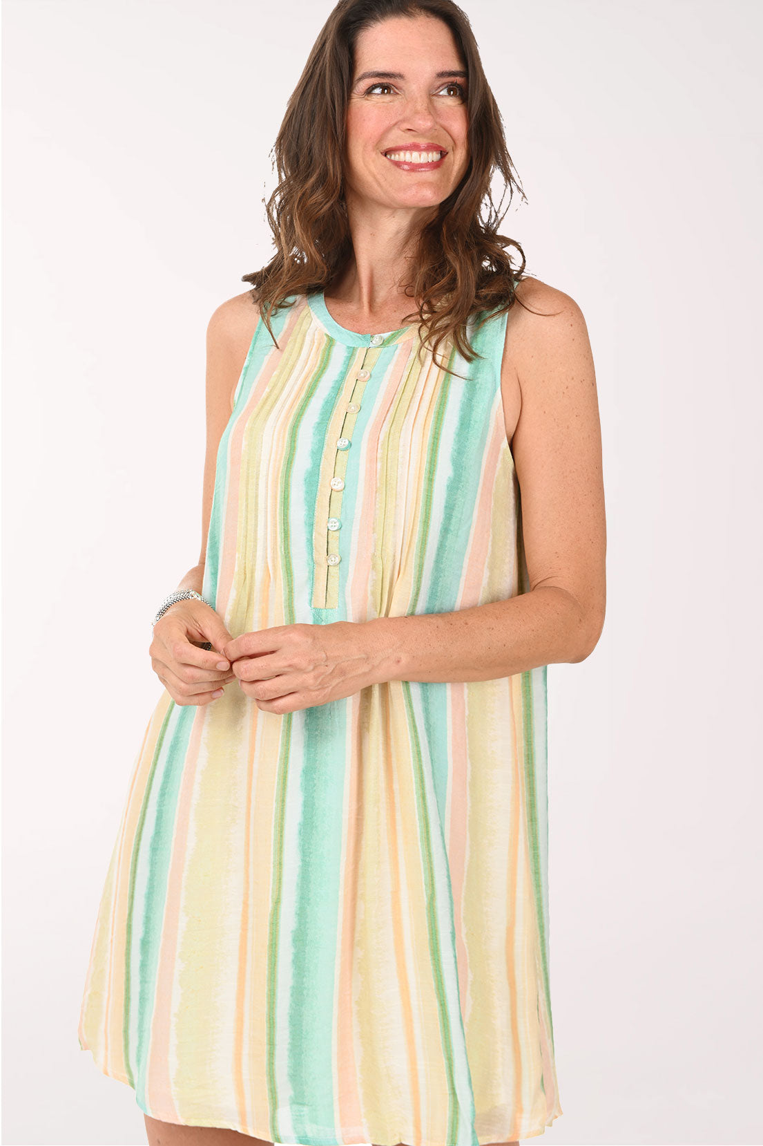 Woman wearing a striped dress on a white background