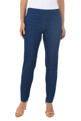 A front shot of blue jeggings worn by a person on a white background. 