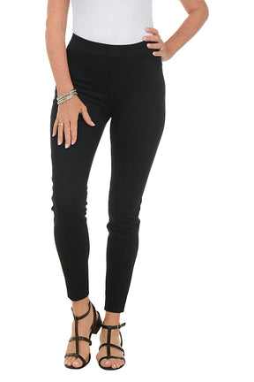 front shot of our model wearing black leggings and a white top on a white background