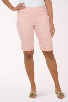 Person wearing pink shorts on a white background