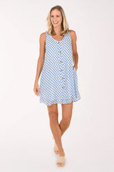 Woman wearing a blue patterned dress on a white background