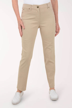 Beige pants worn by a person on a white background