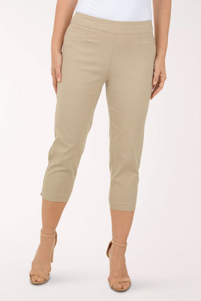 A woman wearing brown crop pants.