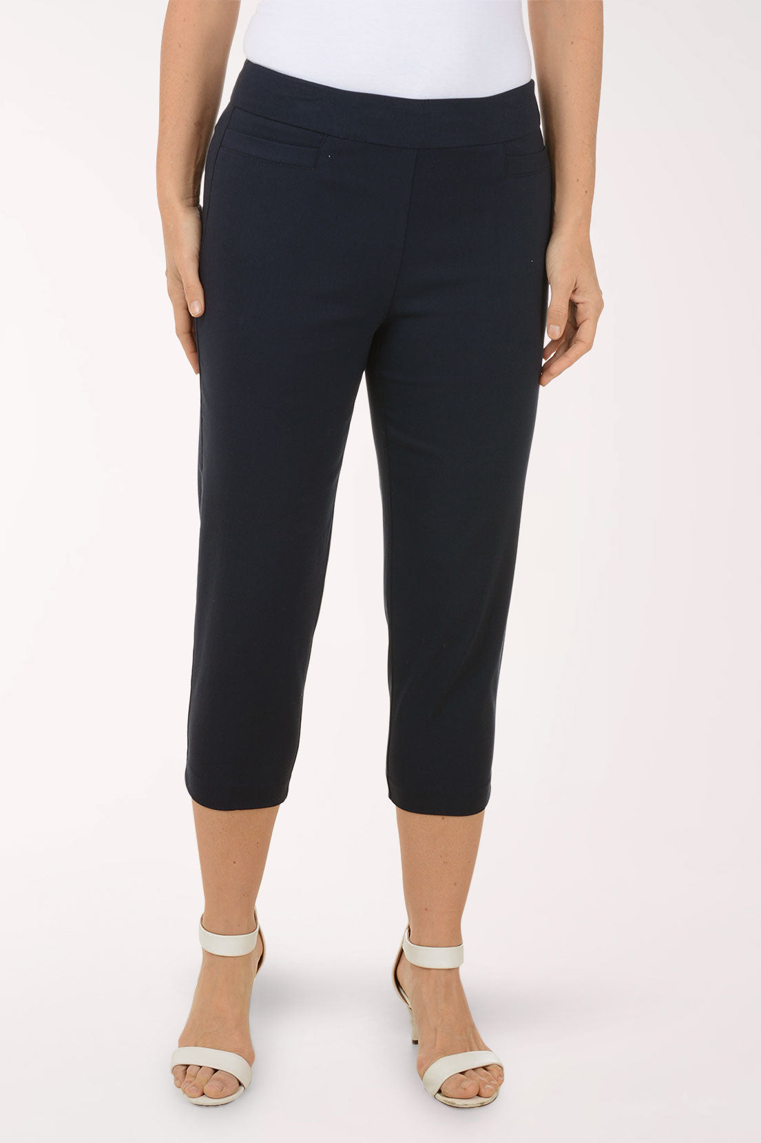 A woman wearing blue crop pants.