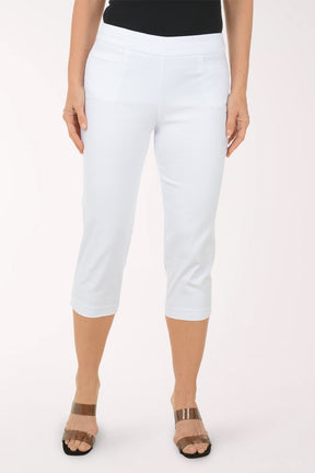 A woman wearing white crop pants.