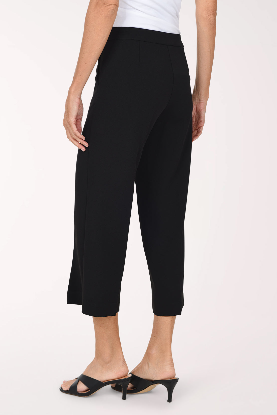 Woman wearing black crop pants