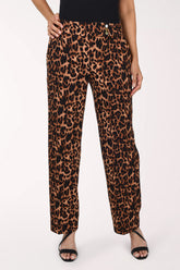 Woman wearing full length animal print pants 