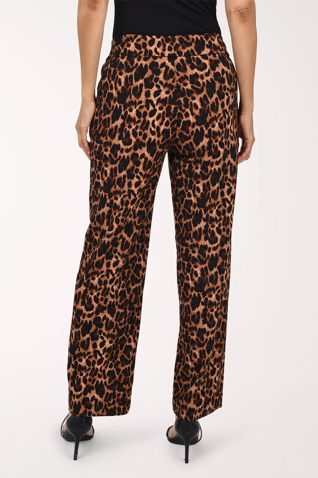 Woman wearing full length animal print pants 